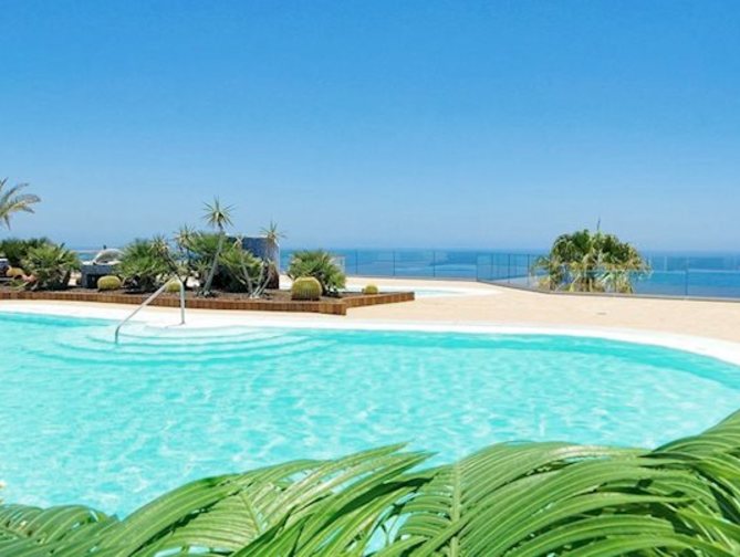 Zee en strand bij het Riosol Hotel in Puerto Rico, Spanje foto 2