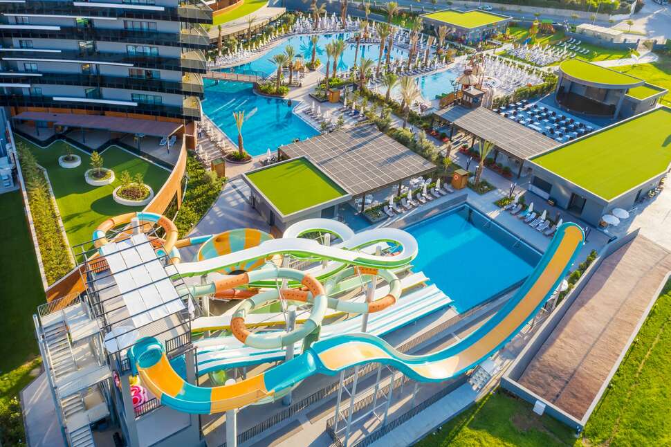 Zwembad met glijbanen van Calyptus Kirman Premium Hotel Side, Turkije foto 2